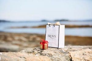 Keeping You Comfortable and Safe. Shopping bag and gift box at the beach